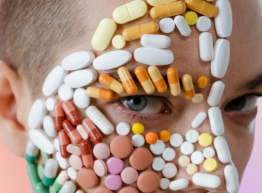 Woman with pills stuck on her face